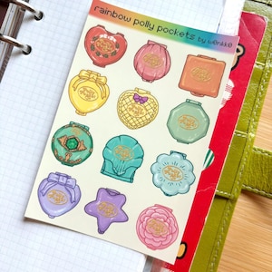 May include: A sheet of colorful Polly Pocket stickers featuring various shapes like hearts, shells, and stars. The stickers are in shades of red, pink, yellow, green, and purple, with gold accents and the text "rainbow polly pockets" at the top.