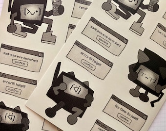 Op de afbeelding: Een set zwarte en witte stickers met cartoonfiguren met computerschermen en foutmeldingen. De berichten zijn "sadness.exe launched", "error!!!! help!!!", "it's time to jam!!!" en "restart your PC now!! or else".