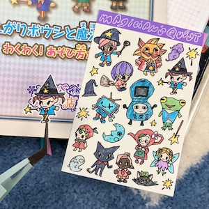 May include: A sheet of stickers with the text "Magician's Quest" featuring cartoon characters, including wizards, a sun, a frog, and a cat. The stickers are hand-drawn with black outlines and filled with various colors.