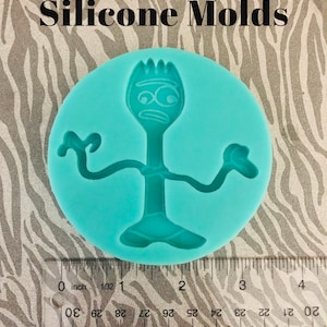 May include: A turquoise silicone mold shaped like the character Forky from the Toy Story movie. The mold is approximately 2 inches in diameter.