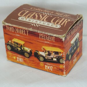 May include: A brown box with the text "Collector's Set of Classic Car Miniatures" on the top. The box contains three miniature cars: a green 1910 Ford Model T, a black 1907 Peugeot, and a blue 1908 Fiat Model 50.