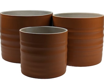 Matte Amber Ceramic Planter - Three Sizes. Indoor plant pot in multiple sizes with physical hooped banding and matte amber colour.