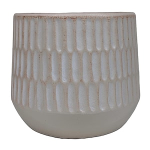 May include: White ceramic planter with a textured, embossed design. The planter has a rounded shape and a smooth, white finish.