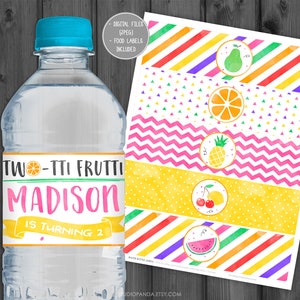 May include: Water bottle labels with a colourful fruit theme. The labels feature a variety of fruits, including a pear, orange, pineapple, cherries, lemon, and watermelon. The labels are designed for a birthday party with the text "Two-tti Frutti Madison is turning 2".