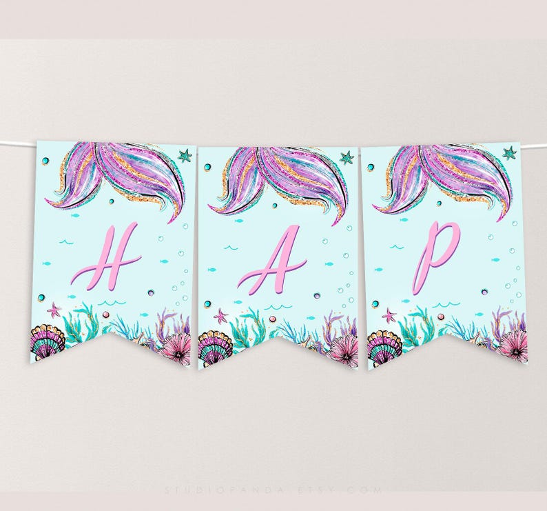 May include: A blue and pink mermaid-themed banner with the word "HAP" in pink letters. The banner features glitter, seashells, and mermaid tails.