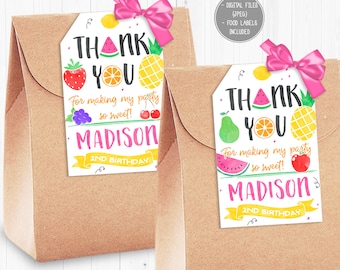 May include: Two white thank you tags with a fruit theme. The tags have a pink bow and say "Thank You" with a watermelon, pineapple, orange, and other fruits. The text also says "For making my party so sweet!" and "Madison 2nd Birthday".