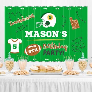 May include: A green and white football-themed party backdrop with the text "Touchdown" and "MASON'S 5TH Birthday PARTY!"  The backdrop is decorated with footballs, a football helmet, and a football jersey.