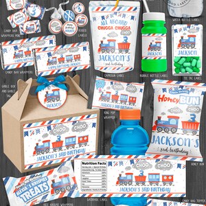 May include: A set of printable party labels and wrappers featuring a blue and red train theme. The labels and wrappers are designed for a child's 3rd birthday party and include the name "Jackson".