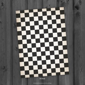 May include: Black and white checkered pattern with a vintage, distressed look. The pattern is reminiscent of a race track finish line. The text "BACKSIDE" and "STUDIOPANDA.ETSY.COM" is printed at the bottom of the image.