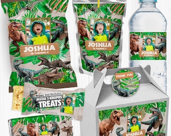 May include: A set of dinosaur-themed party favor boxes, bags, and water bottle labels. The labels feature a photo of a child with the name "Joshua" and the text "is turning 5". The boxes and bags have a green and brown jungle pattern with dinosaurs.