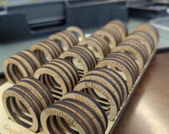 handmade wooden condition rings for 25mm miniatures. 4 of each of 16 conditions (64 rings in total plus small stand)