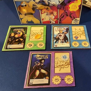 Upgraded Laser Cut Player boards for Sentinels of the Multiverse (Heroes and Villains) definitive edition.