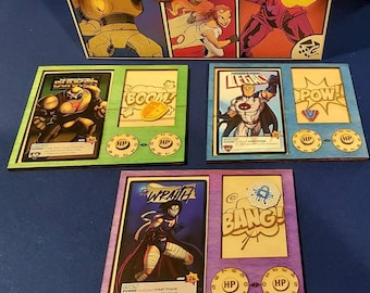 Upgraded Laser Cut Player boards for Sentinels of the Multiverse (Heroes and Villains) definitive edition.