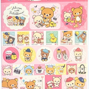 May include: A sheet of stickers featuring Rilakkuma bear characters in various poses. The stickers include images of the bear with cameras, ice cream, and other accessories. The color palette is primarily pink, white, and brown.