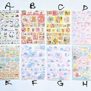 May include: A selection of sticker sheets with cartoon characters. The sheets display designs with pandas, bears, and other cute illustrations in pink, blue, and yellow. These stickers are suitable for scrapbooking and crafts, perfect for adding a touch of fun.