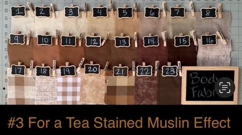 May include: A collection of twenty-three fabric swatches in various shades of brown, beige, and cream, each labeled with a numbered chalkboard tag. A larger chalkboard sign in the bottom right corner displays the text Body Fabric.