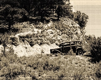 Vintage car photo, fine art photograph, black and white photo, mountain side with trees, picture of vehicle