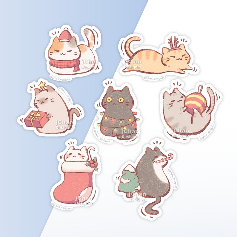 May include: Set of six Christmas-themed cat stickers. The stickers feature cats wearing Santa hats, holding ornaments, and wearing Christmas lights. The stickers are white with a light blue background.