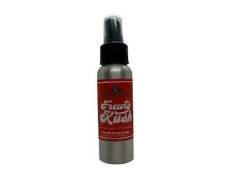 May include: A silver spray bottle with a black cap and a red label that says "Frewty Rush" with a small logo above the text. The bottle is 2 fl oz.