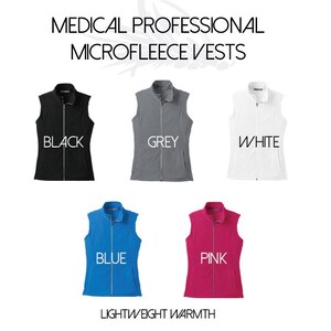 May include: Five microfleece vests in different colors: black, grey, white, blue, and pink. The vests are lightweight and have a zipper closure. The text "MEDICAL PROFESSIONAL MICROFLEECE VESTS" is at the top of the image. The text "LIGHTWEIGHT WARMTH" is at the bottom of the image.