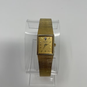 Vintage Bulova Diamond Accent Watch: Gold Tone Tank, West Germany Quartz