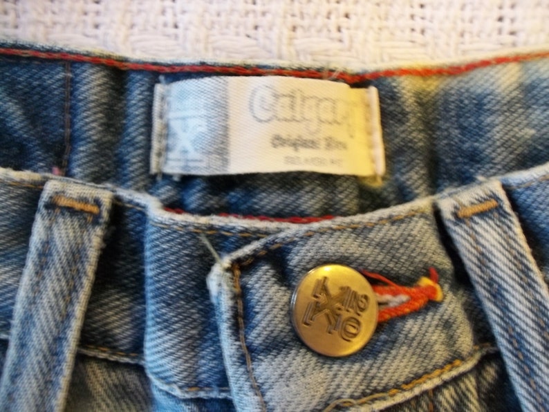25 plus Waist Vintage 80s-90s HighWaist Acid Washed Brass Studded Wrangler Calgery Jeans Cut Off Shorts XSmall