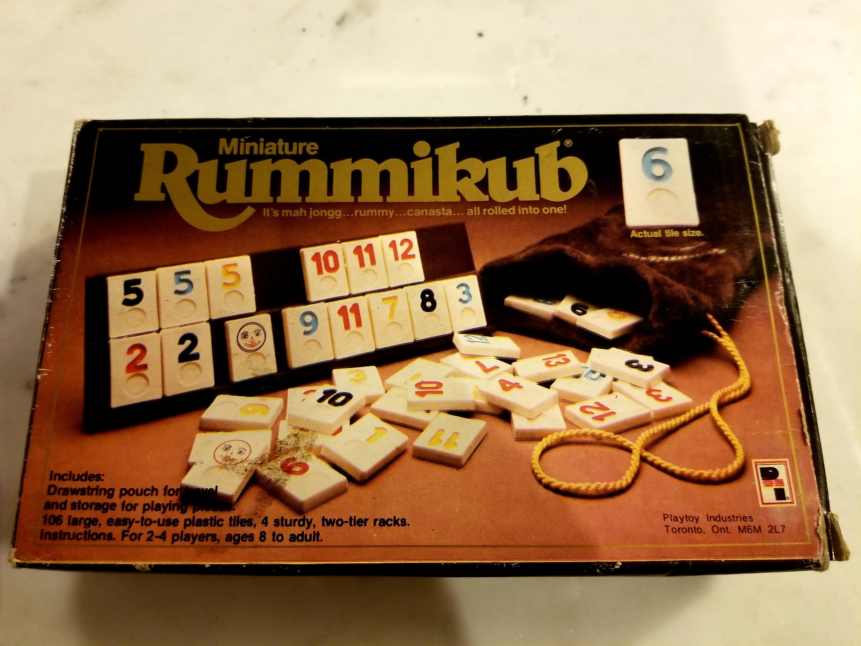 Rummikub - The Complete Original Game With Full-Size Racks and Tiles in a  Durable Canvas Storage/Travel Case by Pressman -  Exclusive