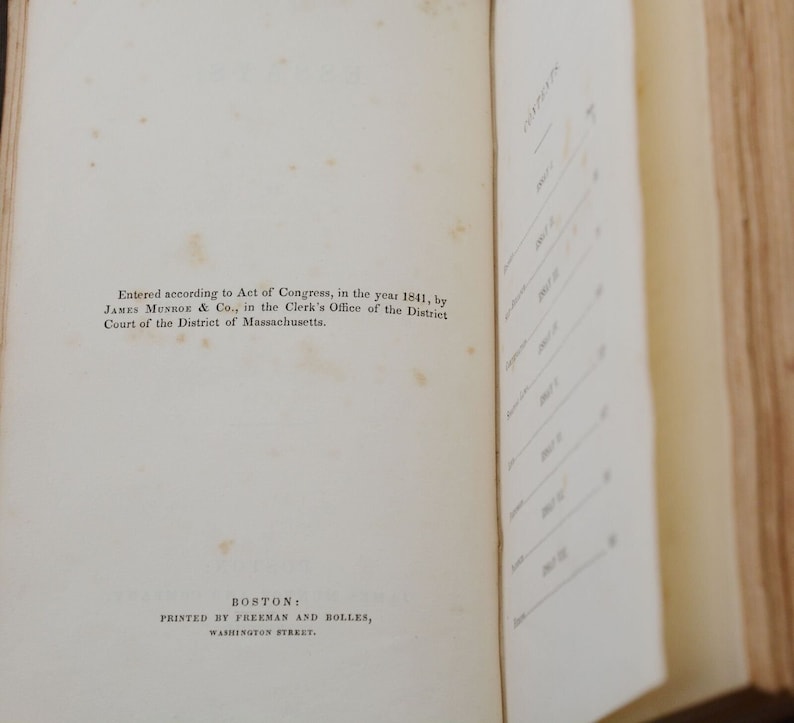 May include: A page from an old book with text about copyright information. The text reads "Entered according to Act of Congress, in the year 1841, by JAMES MUNROE & Co., in the Clerk's Office of the District Court of the District of Massachusetts. BOSTON: PRINTED BY FREEMAN AND BOLLES, WASHINGTON STREET."