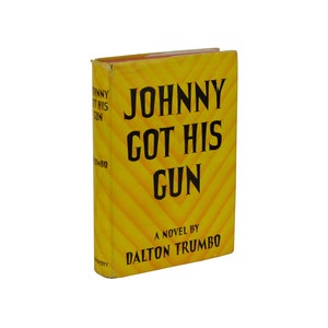 May include: A yellow book with a black title that reads "JOHNNY GOT HIS GUN" and the text "A NOVEL BY DALTON TRUMBO" on the cover.