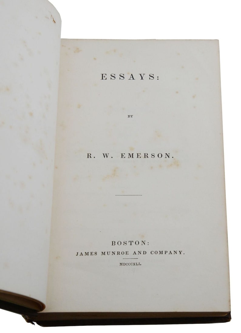 May include: A book titled "Essays" by R. W. Emerson, published in Boston by James Munroe and Company in 1841.