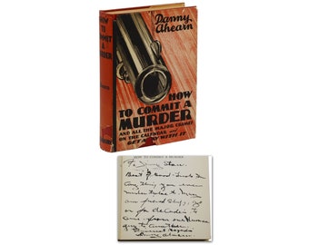 May include: A red and white book titled "How to Commit a Murder" by Danny Ahearn. The book cover features a cartoon illustration of a cannon. The book is signed by the author with a handwritten note.