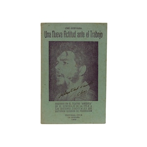 May include: A green book cover with the title "Una Nueva Actitud ante el Trabajo" and a black and white photo of Che Guevara. The book was published in 1962 by Editorial CTC-R in La Habana.