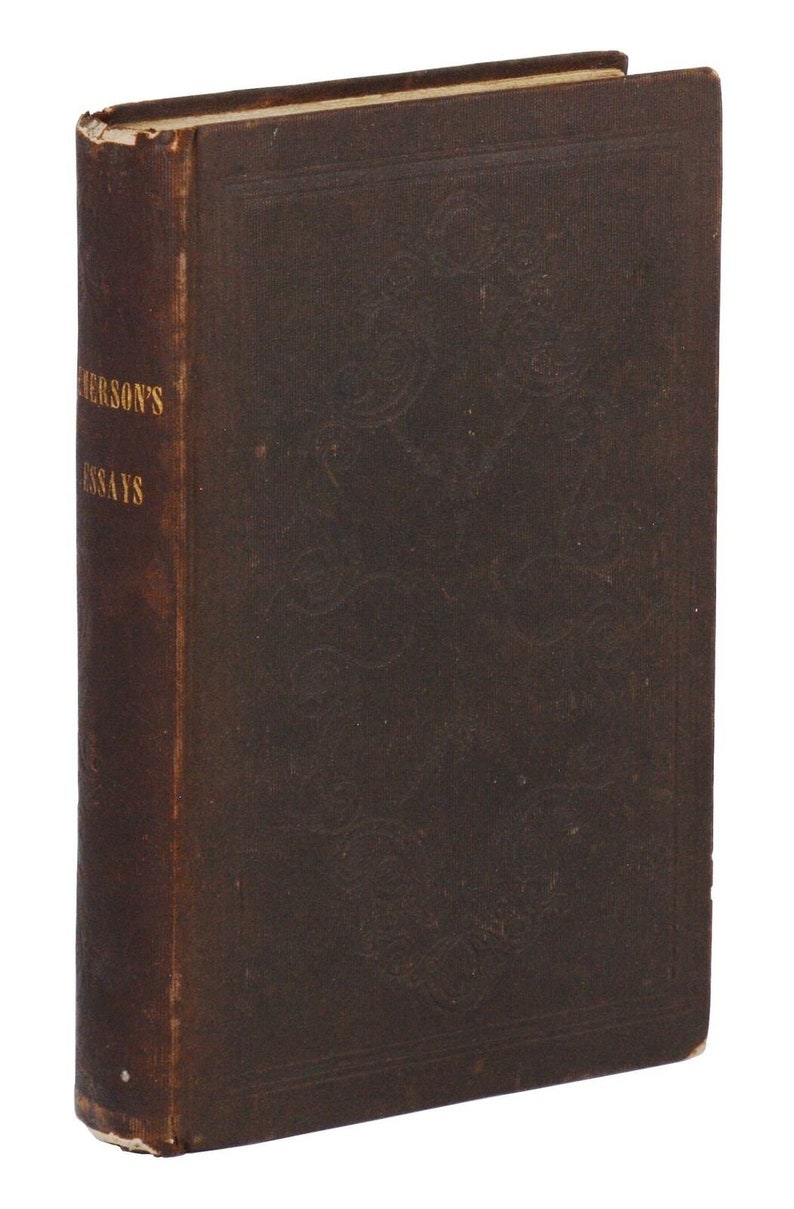 May include: A brown leather-bound book with gold lettering on the spine that reads "Emerson's Essays".