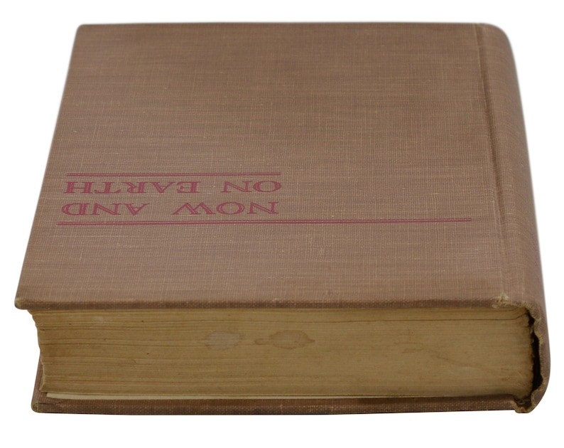 May include: A brown hardback book with the title "NOW AND ON EARTH" printed in red on the front cover.