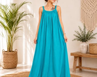 Abito lungo in cotone turchese, vestibilità ampia stile boho, senza maniche, perfetto per le vacanze estive al mare.