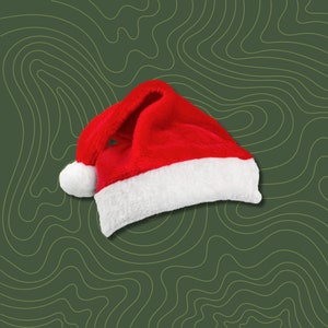 May include: A red and white Santa hat with a white pom-pom on top. The hat is lying on a green background with a wavy pattern.