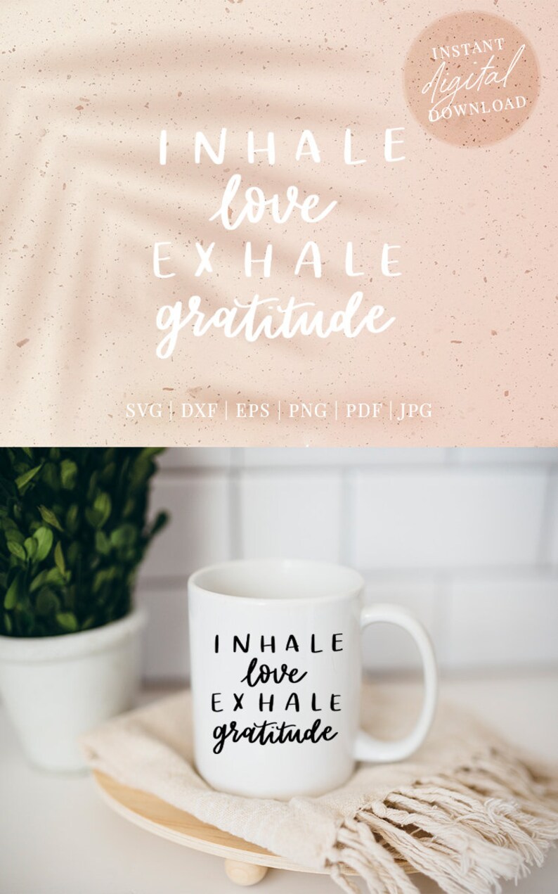 May include: White ceramic mug with black text that reads "INHALE love EXHALE gratitude". The mug is sitting on a wooden coaster with a beige fabric napkin.