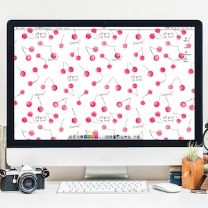 Può includere: Uno schermo di computer che mostra uno sfondo bianco con un motivo ripetitivo di ciliegie rosse e il testo "Will you be my cherry?" e "Cherries!"