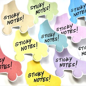 May include: Nine colourful roller skate-shaped sticky notes with the text "STICKY NOTES!" written on each one.