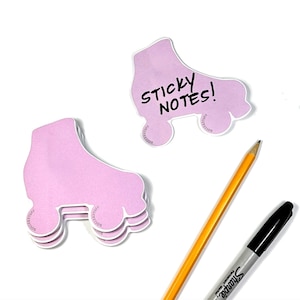 May include: Pink roller skate shaped sticky notes with the text "STICKY NOTES!" written on one of the notes.