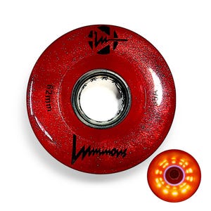 May include: Red roller skate wheel with the word "Luminous" and the measurement "62mm" printed on the wheel. The wheel has a glittery texture and a black logo. A smaller, lit-up wheel is shown to the right, with orange lights.