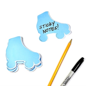 May include: Blue roller skate shaped sticky notes with the text "STICKY NOTES!" written on one of the notes. A yellow pencil and a black Sharpie marker are also in the image.