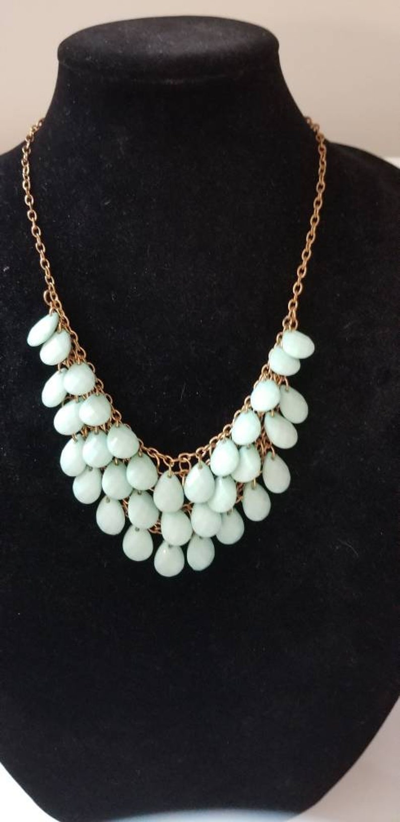 Multi strand turquoise colored necklace. Beautiful
