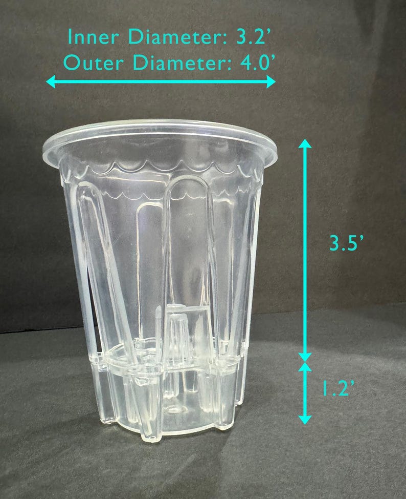 May include: A clear plastic pot with an inner diameter of 3.2 inches and an outer diameter of 4.0 inches. The pot is 3.5 inches tall, with a base that is 1.2 inches high. The pot has a scalloped rim and vertical ridges.