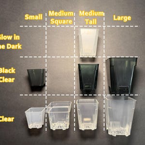 May include: An assortment of clear and black plastic plant pots in various sizes: small, medium square, medium tall, and large. The pots are labeled "Glow in the Dark", "Black Clear", and "Clear". The image is on a dark background.