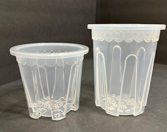 May include: Two clear plastic plant pots with a scalloped rim and drainage holes. The pots are different sizes.