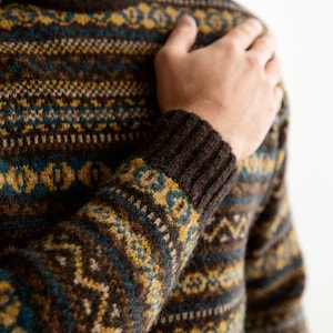 Mens fair isle jumper sweater in brown, yellow and teal wool showing close up of Kinnaird pattern