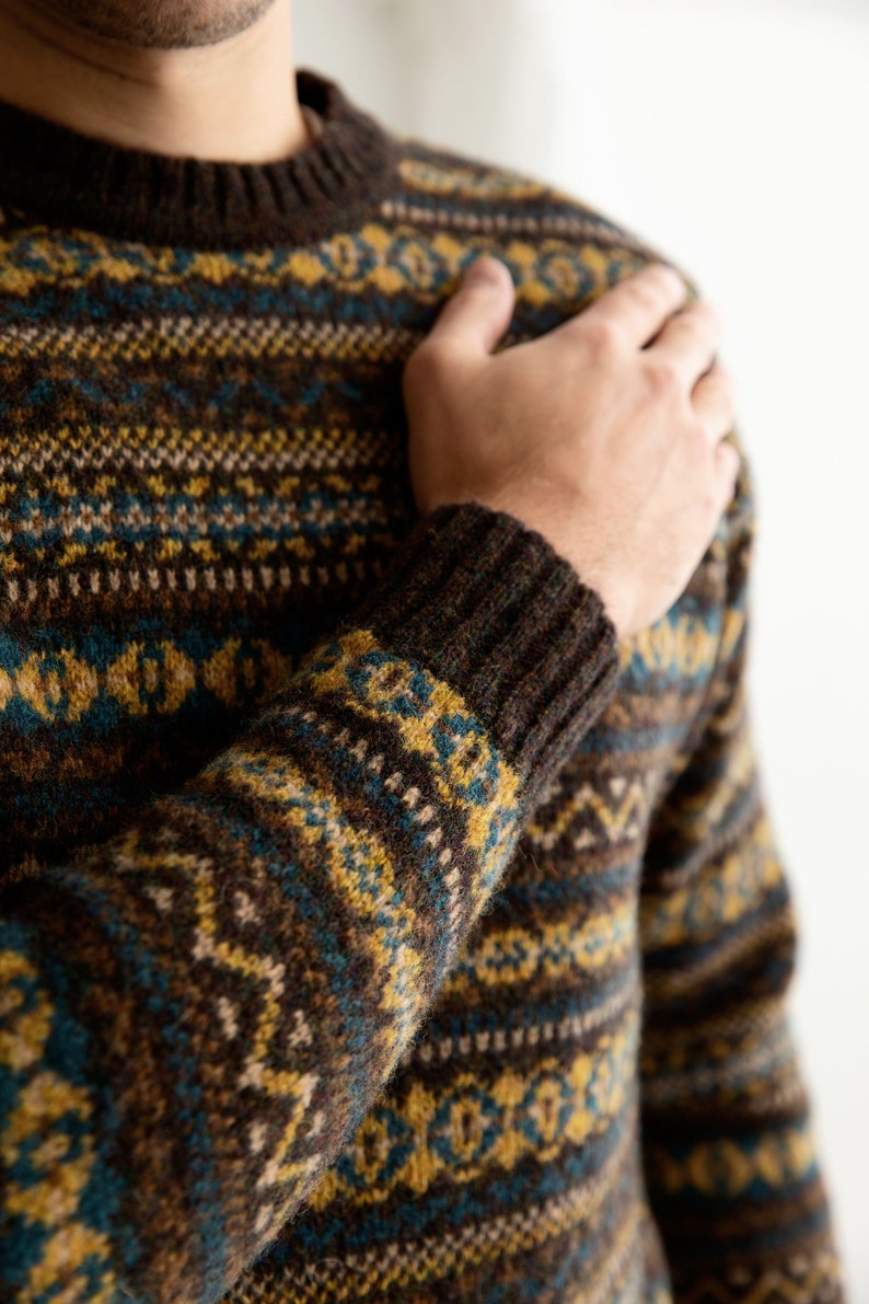 Mens fair isle jumper sweater in brown, yellow and teal wool showing close up of Kinnaird pattern