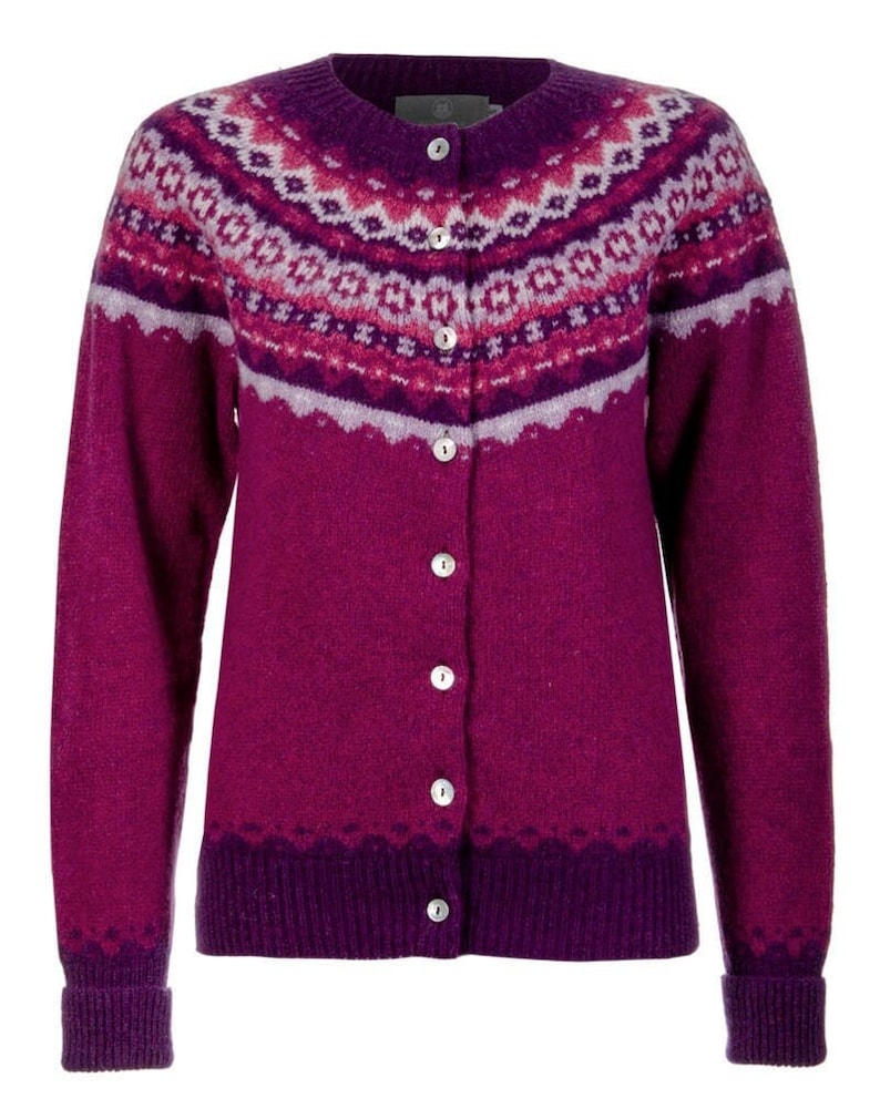 Front image of fuchsia pink Crathie fair isle cardigan with magenta and lilac pattern. Showing shell buttons
