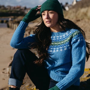 Sky blue fair isle wool jumper with green pattern at yoke